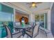 Spacious outdoor patio with stylish furniture, perfect for relaxing and enjoying scenic views at 9203 Griggs Rd # A302, Englewood, FL 34224
