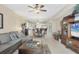 Open-concept living room with access to the kitchen and dining area, features comfortable seating and decor at 9203 Griggs Rd # A302, Englewood, FL 34224