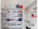 Large pantry features ample shelving, providing plenty of storage for groceries and household essentials to keep organized at 9203 Griggs Rd # A302, Englewood, FL 34224
