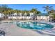 Stunning community pool with clear water and lush landscaping, perfect for summer relaxation at 9203 Griggs Rd # A302, Englewood, FL 34224