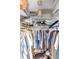 Organized walk-in closet offering ample storage solutions for clothing, accessories, and personal items at 94 Strathmore Blvd, Sarasota, FL 34233