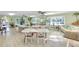 Community center and common area with tables, chairs, and decorations at 94 Strathmore Blvd, Sarasota, FL 34233