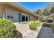 Charming exterior with well-kept landscaping, teal shutters, and a clear view of the house number at 94 Strathmore Blvd, Sarasota, FL 34233