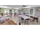 Spacious community meeting room with tables, chairs, modern lighting, and ample space for gatherings at 94 Strathmore Blvd, Sarasota, FL 34233