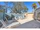 Outdoor patio features lounge chairs, tables, and a storage shed for outdoor fun and relaxing at 94 Strathmore Blvd, Sarasota, FL 34233