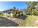 Charming home featuring well-manicured lawn, mature landscaping, and attractive exterior with shuttered windows at 94 Strathmore Blvd, Sarasota, FL 34233
