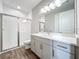 Stylish bathroom with modern vanity, glass shower door, and tile surround at 10006 Degas Ter, Bradenton, FL 34212