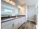 Modern bathroom featuring a double vanity and large mirror with decorative lighting above at 10006 Degas Ter, Bradenton, FL 34212