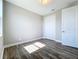Well-lit bedroom featuring wood-look flooring and a large closet space, promoting comfort at 10006 Degas Ter, Bradenton, FL 34212