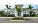 Clubhouse exterior showcasing modern architecture, manicured landscaping, and ample parking at 10006 Degas Ter, Bradenton, FL 34212
