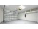 Clean, two car garage with neutral paint, painted floors, and an automatic door opener at 10006 Degas Ter, Bradenton, FL 34212