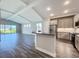 Well-lit kitchen with an open floorplan features stainless steel appliances and light cabinets at 10006 Degas Ter, Bradenton, FL 34212