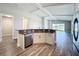 Open-concept kitchen with breakfast bar offers seamless flow to the living area at 10006 Degas Ter, Bradenton, FL 34212