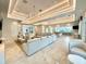 Large living area with neutral tones, modern lighting, and comfortable seating at 10006 Degas Ter, Bradenton, FL 34212