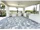 Outdoor kitchen featuring a stainless steel grill, countertop space, and a ceiling fan at 10006 Degas Ter, Bradenton, FL 34212