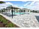 A community pool and patio with sun shades at 10006 Degas Ter, Bradenton, FL 34212