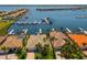 Waterfront homes with private docks and boat lifts on a sunny day at 1009 3Rd E St, Palmetto, FL 34221