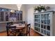 Open dining area with built-in cabinets, wine storage, and elegant chandelier lighting at 1009 3Rd E St, Palmetto, FL 34221