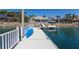 Spacious dock with boat and jet ski lift, and a blue kayak, along with waterfront home at 1009 3Rd E St, Palmetto, FL 34221