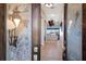 A beautiful foyer with ornate glass doors leads into a beautifully staged home at 1009 3Rd E St, Palmetto, FL 34221