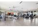 Community gym with lots of exercise equipment, mounted TVs, and ceiling fans for a full body workout at 1009 3Rd E St, Palmetto, FL 34221