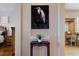 Hallway showcasing a decorative table and view into the bedroom and bathroom at 1009 3Rd E St, Palmetto, FL 34221