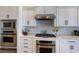 Modern kitchen design with stainless steel appliances, white cabinets, and a stylish backsplash at 1009 3Rd E St, Palmetto, FL 34221