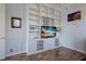 Spacious living room with built-in shelving, cabinets, and a modern television at 1009 3Rd E St, Palmetto, FL 34221