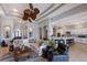 Open concept living room showcasing high ceilings, modern furnishings, and seamless flow to the kitchen at 1009 3Rd E St, Palmetto, FL 34221