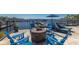 Outdoor seating area with a fire pit and view of the water and marina at 1009 3Rd E St, Palmetto, FL 34221