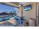 Entertainers backyard with poolside bar, ceiling fan and waterfront view at 1009 3Rd E St, Palmetto, FL 34221