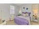 Stylish secondary bedroom with decor, side tables, and a bench at 107 Wayforest Dr, Venice, FL 34292