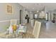Dining area opens to the kitchen, offering easy access and plenty of natural light at 107 Wayforest Dr, Venice, FL 34292