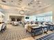 Expansive dining room with tables set for service and ample seating at 107 Wayforest Dr, Venice, FL 34292