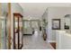 Inviting foyer showcasing marble floors, a display cabinet, and an open view into the home's living spaces at 107 Wayforest Dr, Venice, FL 34292