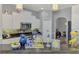 Bright kitchen features white cabinetry, granite countertops, stainless steel appliances, and stylish pendant lighting at 107 Wayforest Dr, Venice, FL 34292