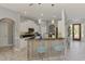 Stylish kitchen with counter seating and access to the front entryway at 107 Wayforest Dr, Venice, FL 34292