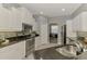Well-equipped kitchen featuring granite counters, stainless steel appliances, and plenty of cabinet space at 107 Wayforest Dr, Venice, FL 34292