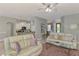 Comfortable living room with tile flooring, open to the kitchen and front entry at 107 Wayforest Dr, Venice, FL 34292
