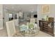 Open floor plan with dining area, kitchen, and living room perfect for entertaining or relaxing at 107 Wayforest Dr, Venice, FL 34292
