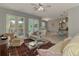 Bright, open living space featuring stylish seating, French doors and adjacent dining area at 107 Wayforest Dr, Venice, FL 34292