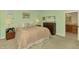 Comfortable main bedroom with neutral tones, carpet, and convenient access to an en-suite bathroom at 107 Wayforest Dr, Venice, FL 34292