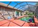 Enclosed pool with access to the house, beautiful outdoor setting with lush landscaping at 107 Wayforest Dr, Venice, FL 34292