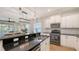 Modern kitchen with granite countertops, stainless appliances, and open to the living area at 11111 Encanto Ter, Bradenton, FL 34211