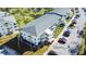 Aerial view of the property showcasing well-manicured landscaping, parking, and building features at 11251 80Th Ave # 305, Seminole, FL 33772