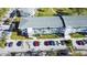 Aerial view showcasing the well-maintained building with parking, landscaping, and nearby roads at 11251 80Th Ave # 305, Seminole, FL 33772