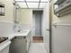 Bright bathroom with white tile, and fixtures, including a sink with vanity and tile flooring at 11251 80Th Ave # 305, Seminole, FL 33772