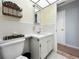 Well-lit bathroom featuring a tiled shower-tub combo, white fixtures, and hexagon tile flooring at 11251 80Th Ave # 305, Seminole, FL 33772