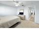 Cozy bedroom with carpet, ceiling fan, dresser, and convenient doorway for a comfortable retreat at 11251 80Th Ave # 305, Seminole, FL 33772