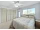 Serene bedroom with soft color palette, large window, ceiling fan and closet for relaxing space at 11251 80Th Ave # 305, Seminole, FL 33772